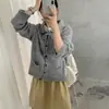 Cárdigan de punto estilo coreano con cuello solapa, detalle de corbata y bolsillos, un nuevo diseño otoño/invierno para mujer, simple, versátil y juvenil, que irradia un ambiente elegante