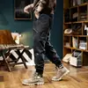 Pantalones de trabajo lavados al agua marca de moda pantalones de chándal desgastados para hombre peso pesado retro casual pantalones para hombre con puños forrados de forro polar pantalones largos de senderismo