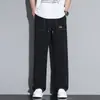 Calça casual solta masculina versátil e moderna plus size, calça de seda gelada elástica para o verão, calça de perna larga com caimento, modelo 79