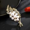 Broche de perla de seguridad con borla, corsage femenino, personalidad, temperamento, versátil, diseño de nicho, hebilla anti-exposición, moda Ins, lujo