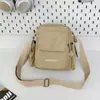 Bolsa para cámara popular transfronteriza con múltiples bolsillos, bolsa ligera de nailon resistente al agua, bandolera y cruzada casual unisex
