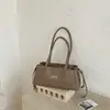 Bolso acolchado tipo Chanel para debajo del brazo, nuevo y moderno de la colección primavera-verano 2026, bolso baguette de alta gama vintage, bolso de mano para hombro para mujer