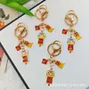 Llavero Colgante Año Nuevo 2026 Metal Zodiaco León Dorado Petardo Despertar Bolsa de la Fortuna Colgante Evento Pequeño Regalo