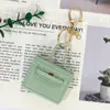 Funda Huayang para Auriculares Modelo Nuevo Bolsa Cuadrada Pequeña Multifuncional Bolsa para Labial Llavero Colgante de Coche de PU AirPods 5ª Generación