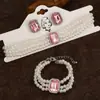 Collar y pulsera de perlas de imitación con flor de diamante francés, cadena de clavícula de nicho de moda, joyería de alta gama que combina con todo.