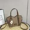 Bolso cubo de moda y sencillo para mujer, nuevo estilo coreano otoño 2026, alta estética, bolso de un solo hombro bajo el brazo