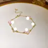 Pulseira Coreana Flor de Quatro Pétalas Cravejada com Diamantes, Pulseira Versátil de Luxo Leve Estilo Coreano, Joia Estilosa e Elegante para Mulheres Atacado