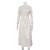 Vestido de Temperamento Estampado de Alta Gama Francés para Mujer 2026 Nuevo Más Vendido Cuello Redondo Manga Corta Cintura Alta Vestido Largo Transfronterizo