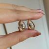 Aretes ovalados de metal con diamantes estilo europeo y americano transfronterizo para comercio exterior, aretes de alto nivel para niñas, joyería de personalidad que combina con todo