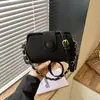 Bolsa transfronteiriça feminina japonesa coreana mini pequena bolsa de clipe feminina 2026 novo estilo moda médica ombro único bolsa de celular tb