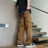 Pantalones cargo anchos de estilo retro para hombre, con bolsillos grandes, un diseño moderno y minimalista, colores lisos, un ajuste versátil y holgado, corte recto y cintura con cordón para uso casual.