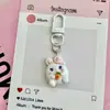 Chaveiro de Animal Fofo Abraçando Frutas Bola de Desenho Sanrio Coração Feminino Pingente de Bolsa Pequeno Ornamento de Presente