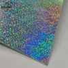 Placa de Flor Láser con Gradiente Suave Hoja de Lata Yuan Shen Animación Bidimensional Insignia Brillante Papel de Almohadilla Delgado