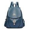 Comercio exterior al por mayor mochila de cuero suave para mujer 2024 nueva moda colgante de gatito mochila para mujer bolsa de viaje de gran capacidad