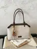 Nuevo bolso de hombro elegante para principios de otoño de 2026, bolso de mano de nicho de alto valor, bolso cruzado tipo cubo de color liso, moderno y simple
