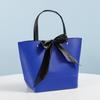 Bolso de mano con lazo y remaches, bolsa de papel, bolsa publicitaria para empresas mayoristas, bolsa de regalo, bolsa de compras, logotipo imprimible