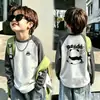 Camiseta base de forro polar alemán de doble cara para niño otoño e invierno estilo coreano prenda superior camiseta base capa interior cuello redondo bloques de color de dibujos animados manga larga