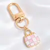 Colgantes de dibujos animados rosas lindos estilo coreano, dijes de aleación de esmalte de conejo y estrella, llaveros con anilla en D, accesorios para manualidades, venta al por mayor