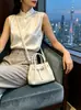 Bolsa pequena elegante e atraente estilo coreano para mulheres, novo modelo 2026, bolsa tiracolo com padrão trançado, bolsa de mão requintada, bolsa tipo balde com necessaire combinando