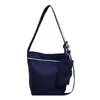 Bolsa estilo preguiçoso feminina 2026 nova bolsa de lona moda casual para trabalho deslocamento bolsa de ombro única bolsa transversal tipo balde