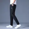 Calça Casual Masculina Fina para o Verão de 2026 Cintura Elástica de Seda Gelada Perna Reta Solta Calça Longa Elástica Calça Respirável de Secagem Rápida