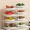 Suporte multifuncional para preparação de alimentos na cozinha, com vários níveis para guardar pratos, travessas e outros utensílios. Ideal para cozinhar panelas, fondue e legumes.