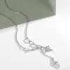 Joyería de Diseño Japonés y Coreano de Nicho Cadena para Suéter Estrella de Ocho Picos Incrustada de Diamantes Borla Larga Colgante de Cruz Versátil Candado
