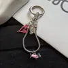 Colgante de salchicha en forma de corazón rosa pálido, dulce y fresco, cadena para teléfono de hueso de serpiente, llavero de dibujos animados lindo y charm para bolso