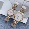 Transmisión en vivo de Tiktok reloj de pareja de acero al cuarzo con banda de berenjena europea tendencia de moda para parejas