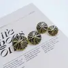 Botón de metal rayado estilo británico estilo Chanel de alta gama, botón para abrigo con pie, sellado con esmalte, costura a mano, venta directa de fábrica