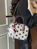 Bolso de Lunares de Nicho Súper Popular para Mujer 2026 Modelo Nuevo Bolso Cruzado Versátil para el Trabajo con Sensación de Bolso de Mano Bolso Almohada