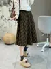 ¡El estilo de la falda es increíble! Falda de lana a cuadros retro para mujer, engrosada y cálida, cintura elástica, falda de longitud media, otoño e invierno, minifalda ajustada