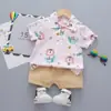 Novo Conjunto Estiloso de Duas Peças de Manga Curta para Meninos, Item Popular de Comércio Exterior, Camisa de Dinossauro Atacado de Fábrica, Roupa de Verão para Crianças Pequenas