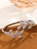 Pulsera y Anillo de Lujo Ligero Completamente Incrustados con Diamantes en Forma de Hoja para Mujer, Diseño de Nicho Pulsera Abierta de Rama de Olivo, Moda Transfronteriza