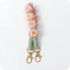 Llavero de Flor Margarita Bohemia de Nuevo Estilo Transfronterizo Cuerda de Muñeca Tejida a Mano Colgante para Bolso Europeo y Americano