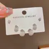 Bolsa da sorte de pérolas com design versátil e moderno estilo francês, conjunto de brincos de três peças, brincos elegantes e simples para o dia a dia para revenda