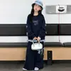 Conjunto de Sudadera para Niñas 2026 Nuevo Estilo Azul Marino Lazos Cuadros Patchwork Falso Dos Piezas Estilo Coreano Dulce Fresco