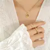 Moda moderna estilo ins coreano regalo versátil para niña Anillo hueco de rama dorada de árbol grande collar con colgante de acero de titanio