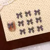 Acessórios para Unhas Mini Laço Atacado 100 Peças Laço de Fita Versátil 3D Resina Decorações de Unhas DIY