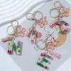Suministros del Fabricante Llaveros con Flores Secas Prensadas 26 Letras del Alfabeto Inglés Llaveros con Borla de Mariposa Charms para Bolsos de Mujer