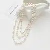 Colección Larga de Collares Superpuestos de Perlas Swarovski para Mujer, Estilo Lujo Ligero, Cadena Versátil para Suéter con un Toque de Alta Gama, Venta al por Mayor Otoño e Invierno