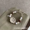 Pulsera de reloj con cuentas color café con leche, reloj de cuarzo simple y artístico estilo ins, retro versátil y de nicho para estudiantes y mujeres