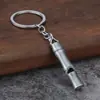 Silbato de aleación Supervivencia al aire libre Portátil Tubo único Estallido Alta frecuencia Decibelio Estéreo Llavero con silbato de metal Colgante
