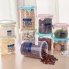 Tarro sellado de plástico transparente de grado alimenticio para almacenamiento de granos de cocina, aperitivos y té seco.