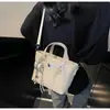 Bolsa de Textura de Luxo para Mulheres 2025 Nova Moda Tendência Nicho Bolsa de Balde Portátil Estilo Estrangeiro Roupa de Trabalho Versátil Bolsa Transversal