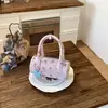 Bolso Pequeño Súper Popular para Mujer, Nuevo Diseño de Nicho Verano 2026 Bolso de Hombro Cruzado, Bolso de Mano Cilíndrico de Venta Caliente Transfronteriza