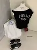 Wgwe9135 Ropa de Mujer Guangzhou Shisanxing Nuevo Estilo 2026 Top Camiseta de Manga Corta con Diseño Estampado de Hombro Descubierto y Cuello Diagonal Verano