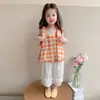 Conjunto para Niña 2026 Nuevo Estilo Moda Coreana Infantil Elegante Niña Pequeña Conjunto de Dos Piezas Cuadros Naranja para Bebé Conjunto de Verano