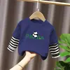 Camiseta de Manga Larga para Niños Ropa de Otoño Capa Base 2026 Nuevo Estilo Top de Retazos Rayado Atractivo Falso Dos Piezas Ropa para Niños