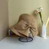 Sombrero de paja de verano plegable de ala ancha con lazo para mujer, adecuado para vacaciones en la playa, protección solar y sombrero de sol elegante